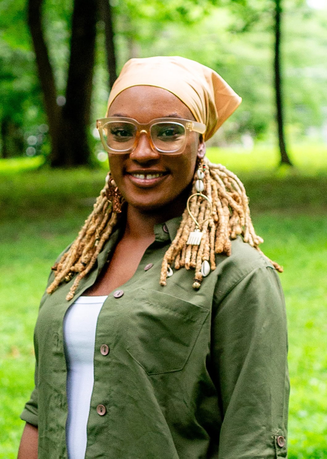 Women gardening, smiling in Knox County green space, showcasing community engagement, sustainable growth, and local food cultivation.